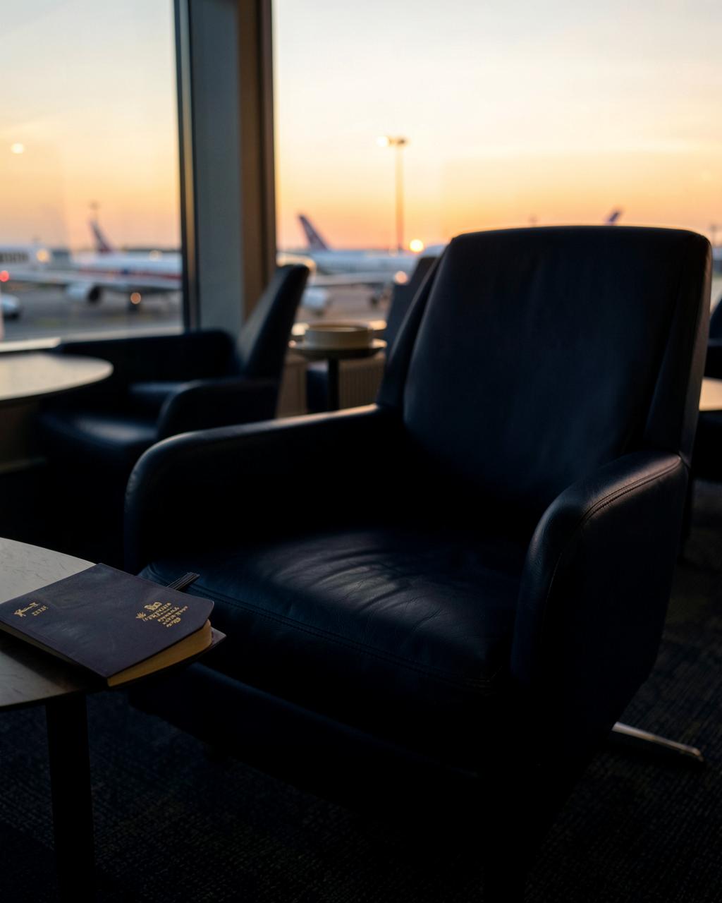 Sunrise airport lounge with a passport resting on a table